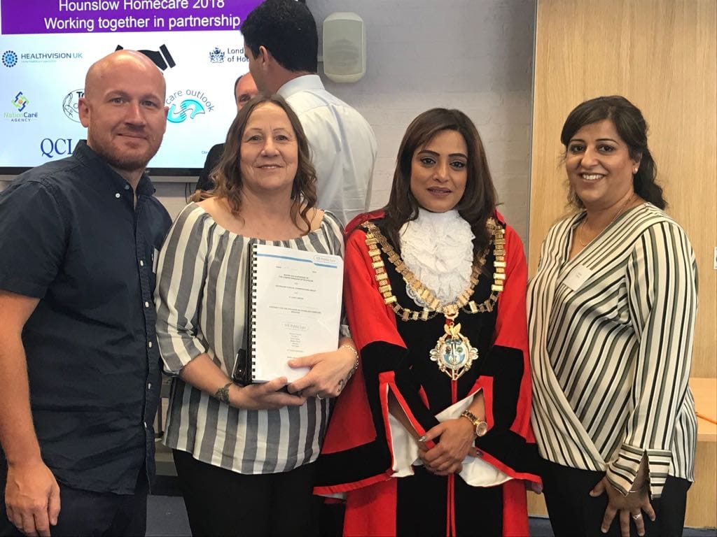 The TC Care management team receiving the Hounslow homecare contract from the Mayor of Hounslow